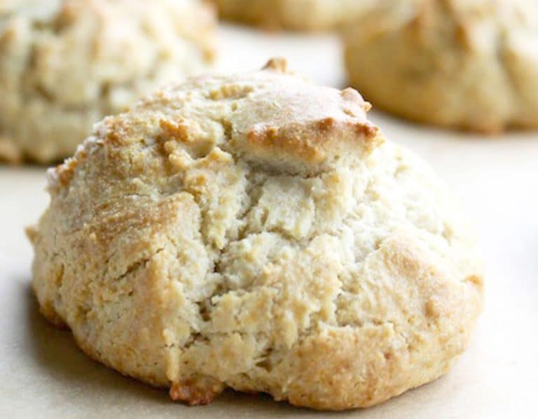 A close up of a drop biscuit on a baking tray.