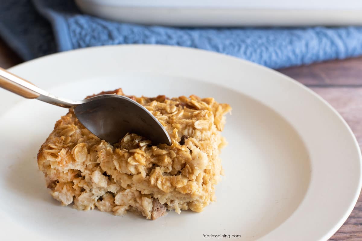 A spoon cutting into the oatmeal.