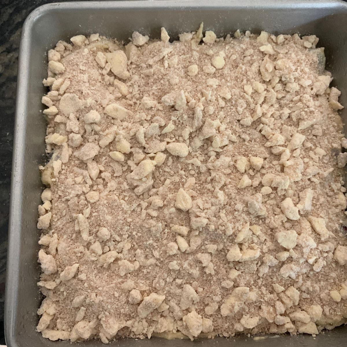 The coffee cake in the pan, ready to bake.