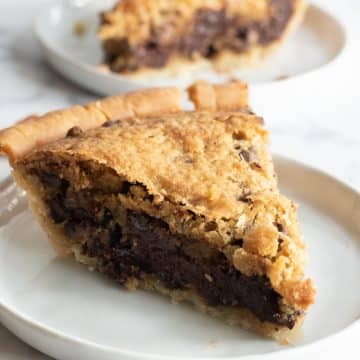 Slices of gluten free derby pie on two white plates.