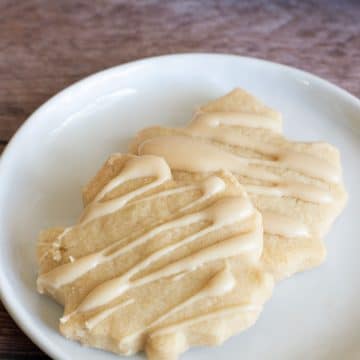 To maple shortbread cookies on a plate.