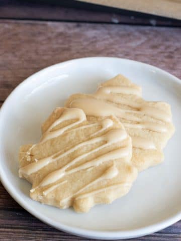 To maple shortbread cookies on a plate.