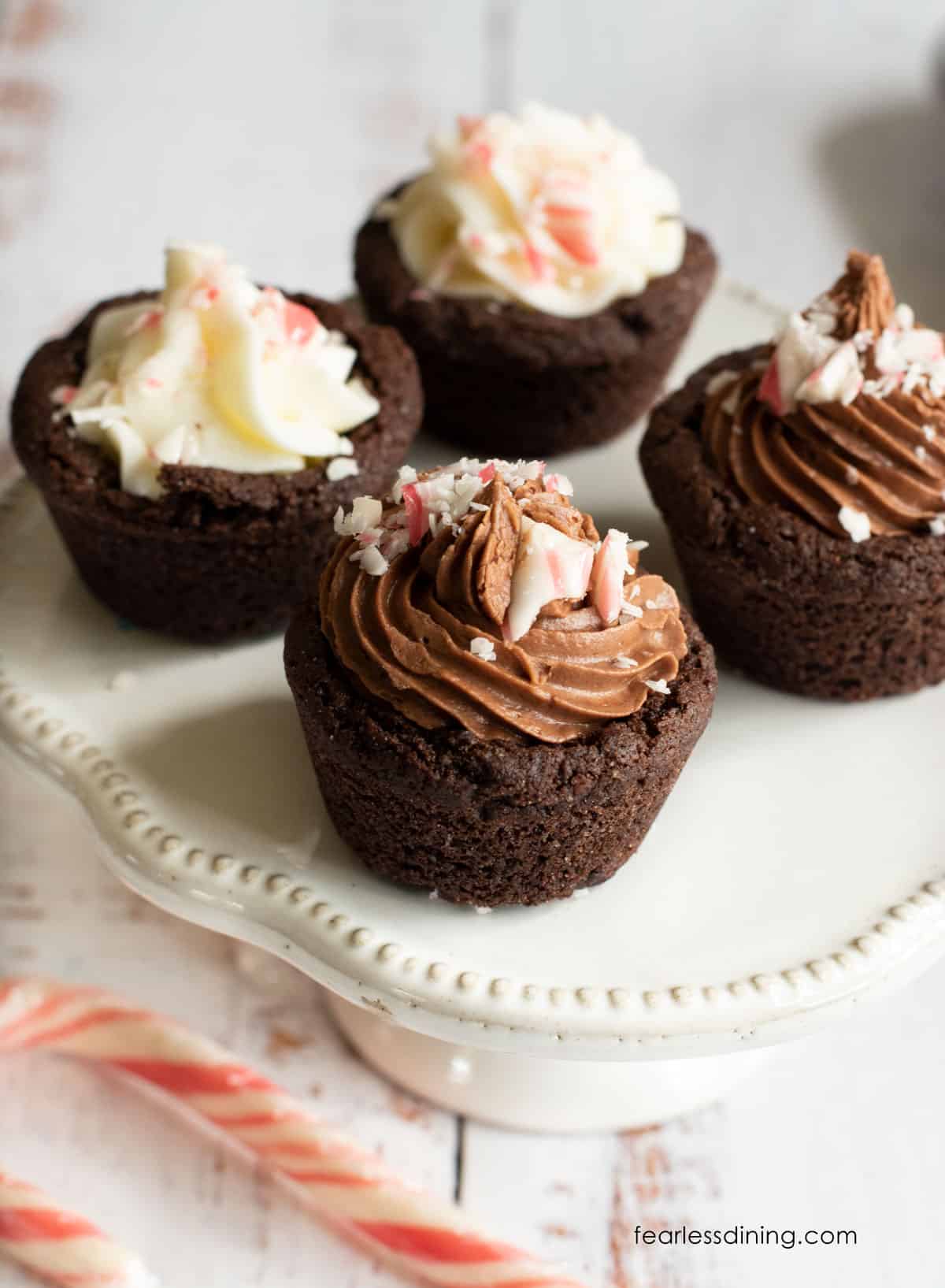 gluten free peppermint cookie cups on a cupcake stand.