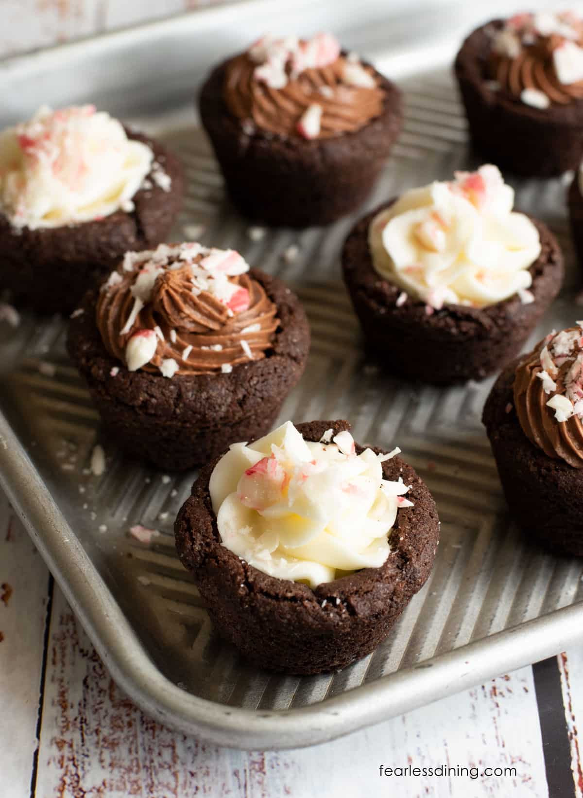 Peppermint cookie cups on a baking sheet.