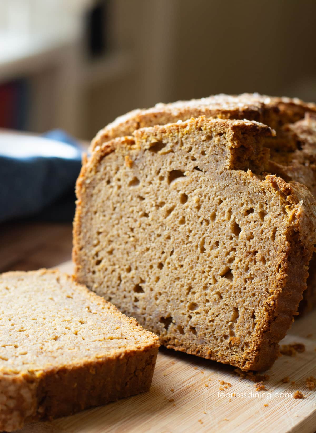A sliced gluten free sweet potato cake on a cutting board.