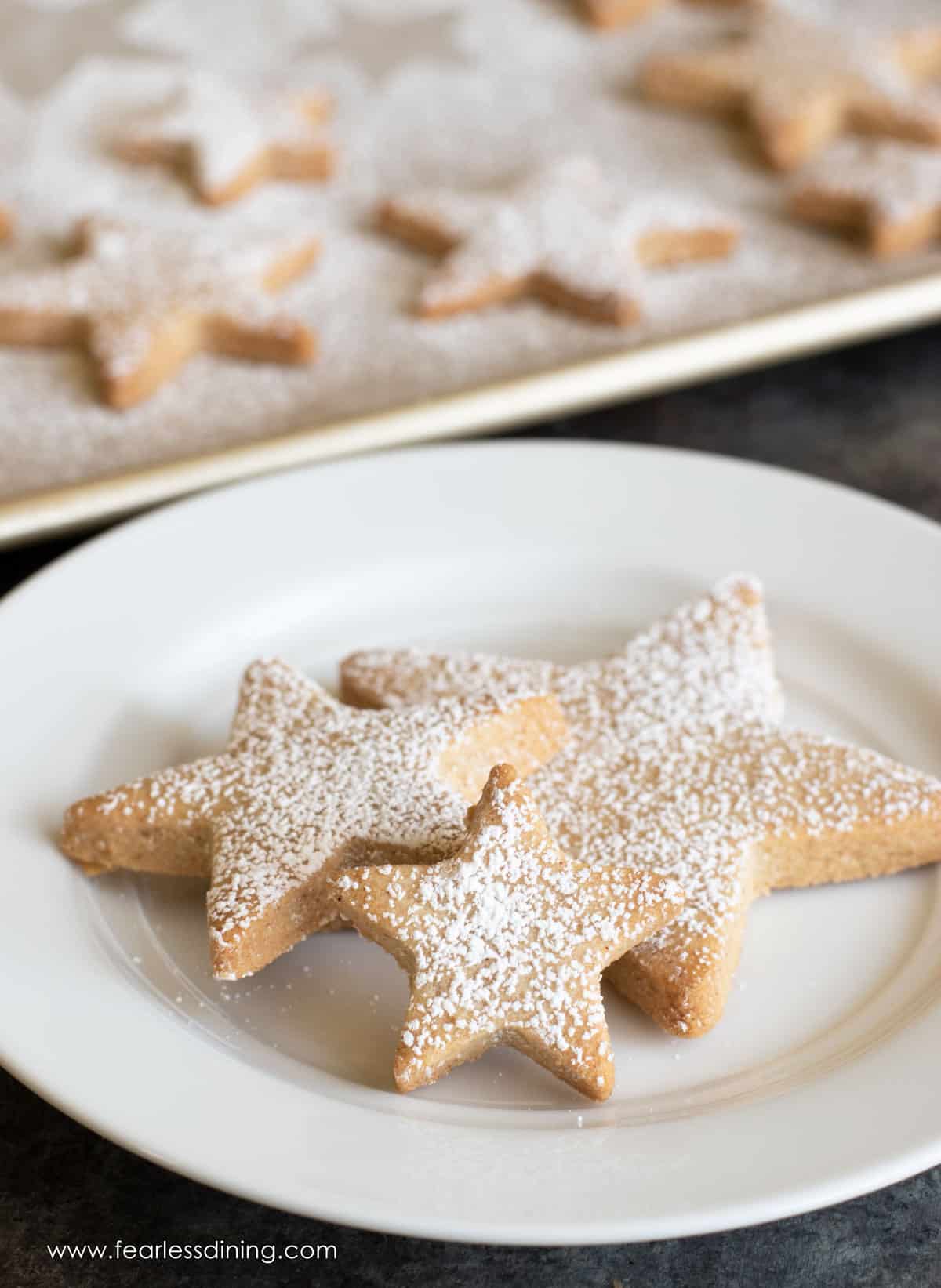 star shaped cookies on a white plate.