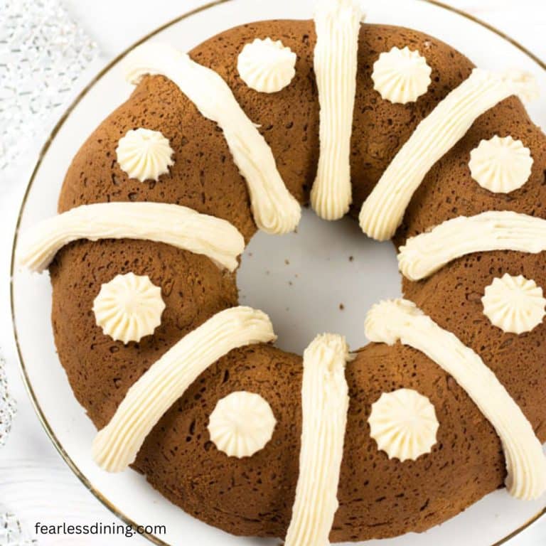 A close up of the frosted gluten free gingerbread bundt cake.