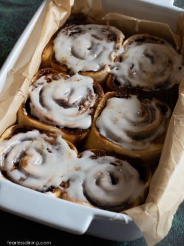 Baked gluten free gingerbread cinnamon rolls with icing.