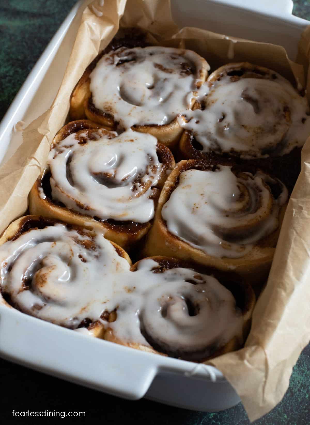 Baked gluten free gingerbread cinnamon rolls with icing.