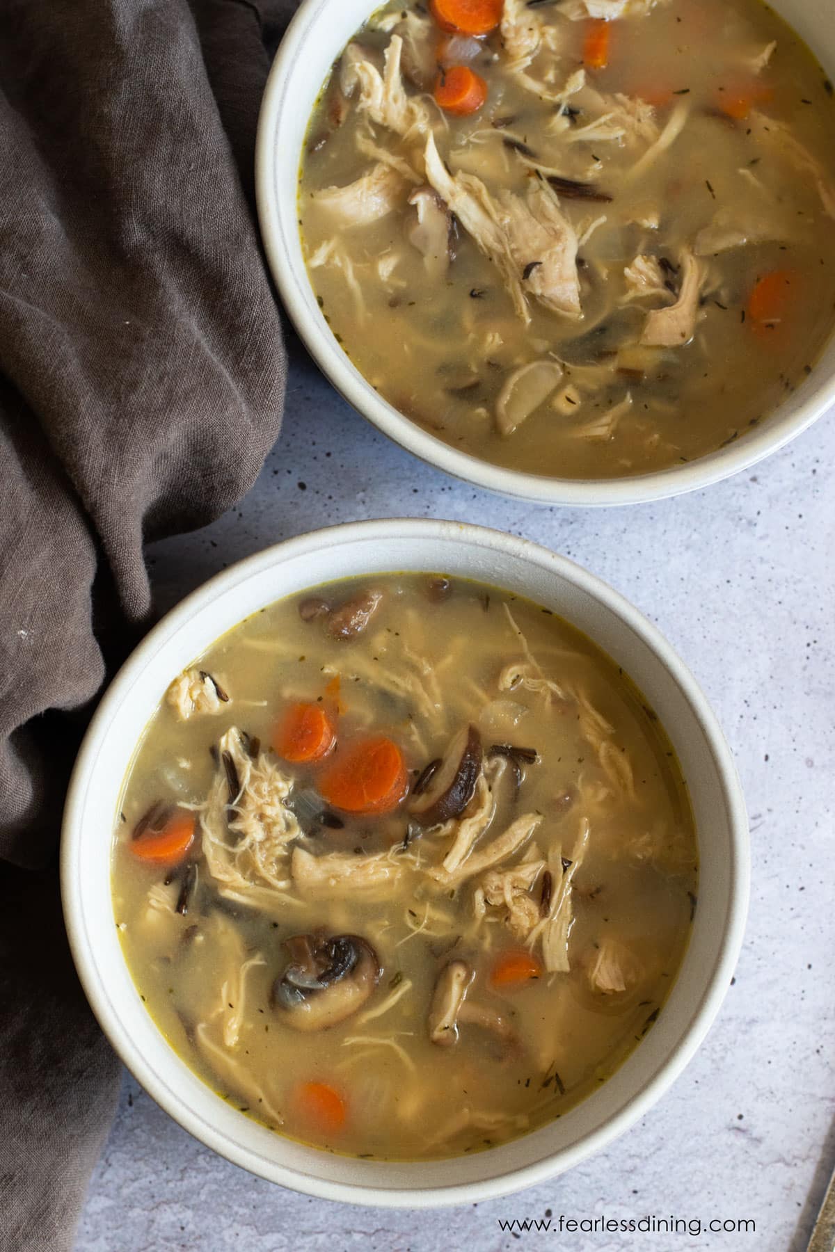 The close up of the two bowls of soup.