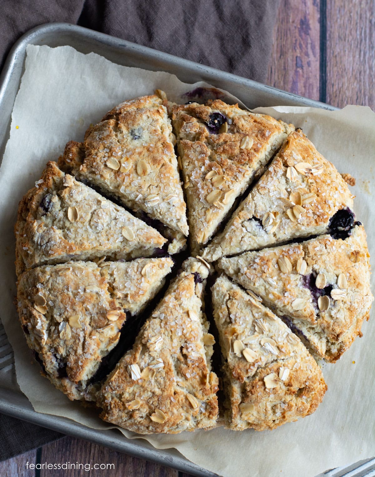 Baked gluten free oat scones on a baking sheet.