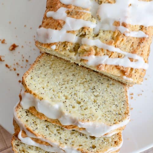 A top view of the sliced gluten free lemon poppy seed cake.