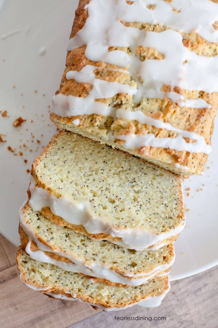 A top view of the sliced gluten free lemon poppy seed cake.