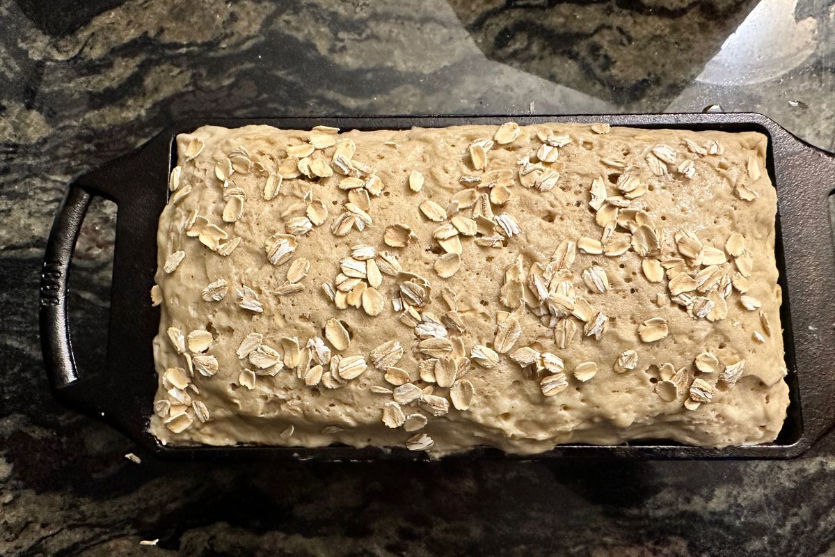 The oat bread in the pan ready to bake.