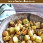 A Pinterest image of a serving bowl filled with roasted rutabaga cubes.