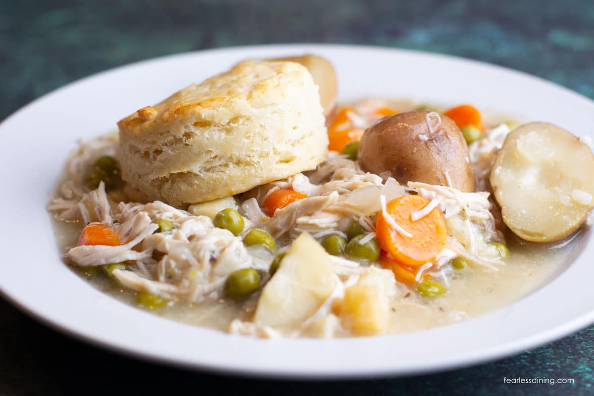 A photo of the slow cooker chicken pot pie in a large white bowl.
