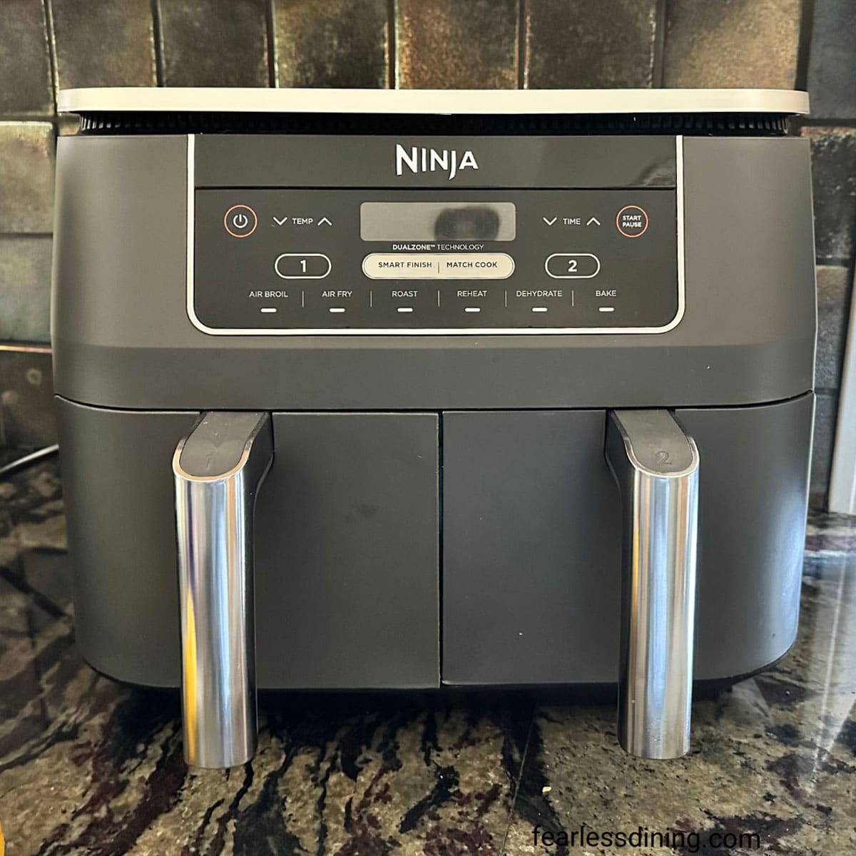 A photo of my Ninja Foodie Dual Zone Air Fryer on my kitchen counter.