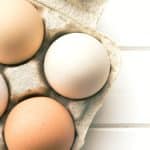 A Pinterest pin image of a carton of eggs.