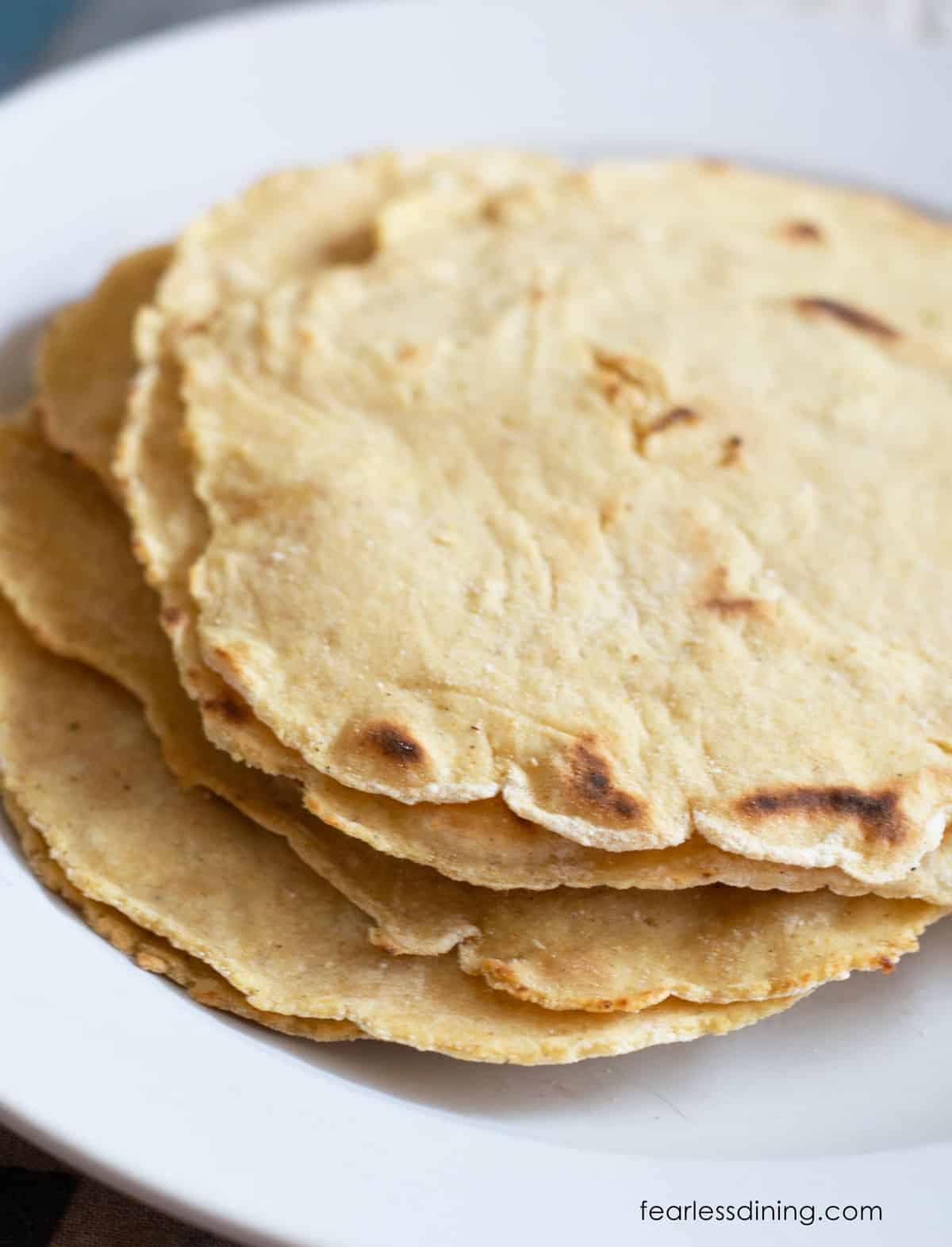 A closeup of the cooked corn tortillas so you can see the char marks.