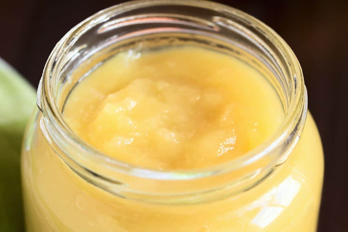 A jar filled with applesauce.