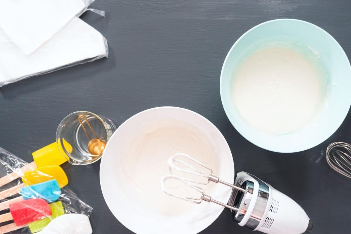 Photo of the royal icing being mixed by an electric mixer.