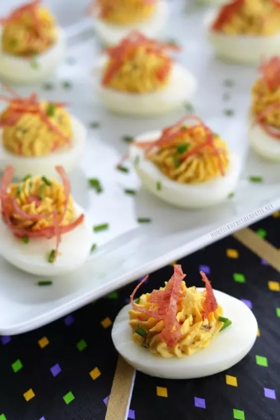Muffuletta deviled eggs on a platter.