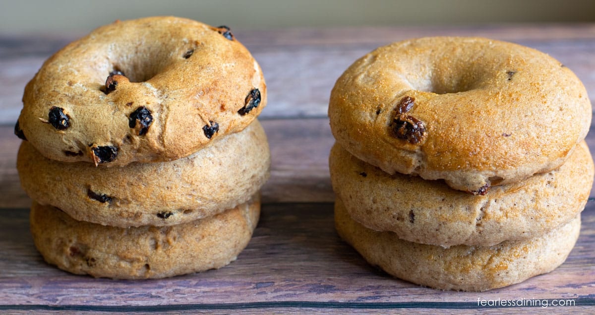 Two stacks of three cinnamon raisin bagels next to each other.