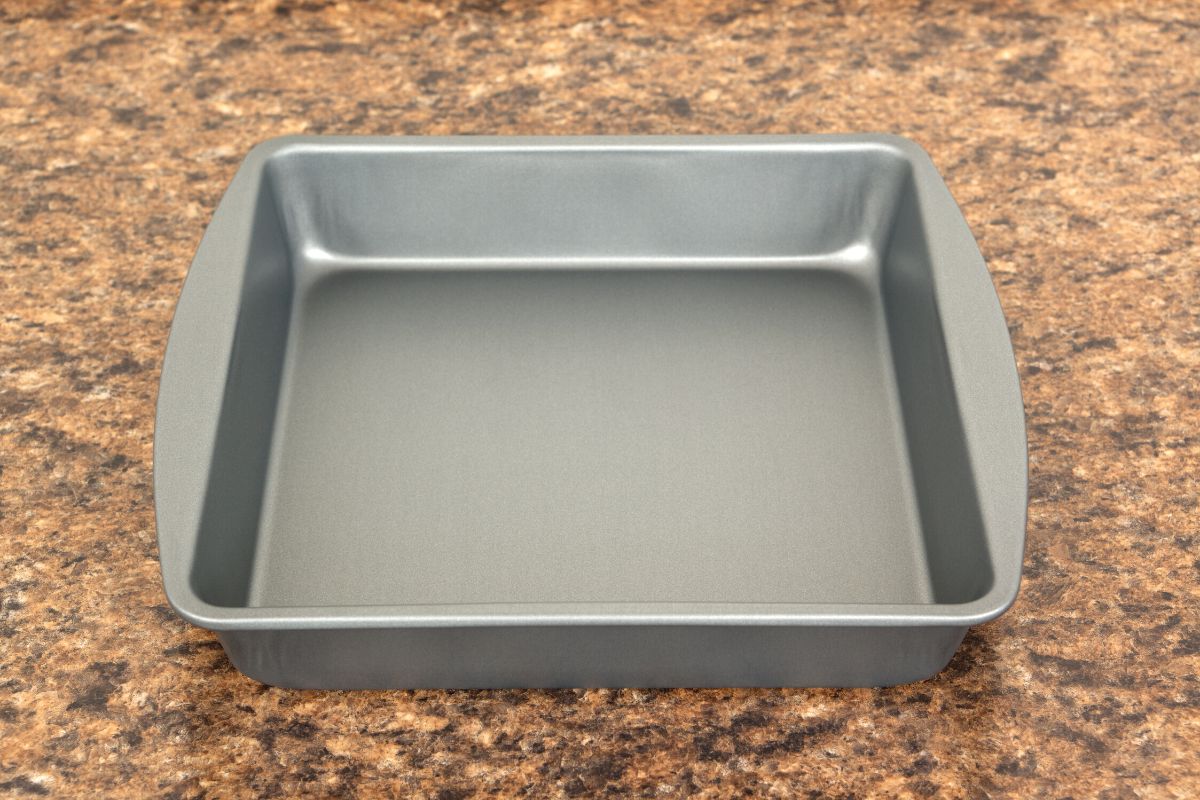 An 8x8 baking pan on a granite counter.