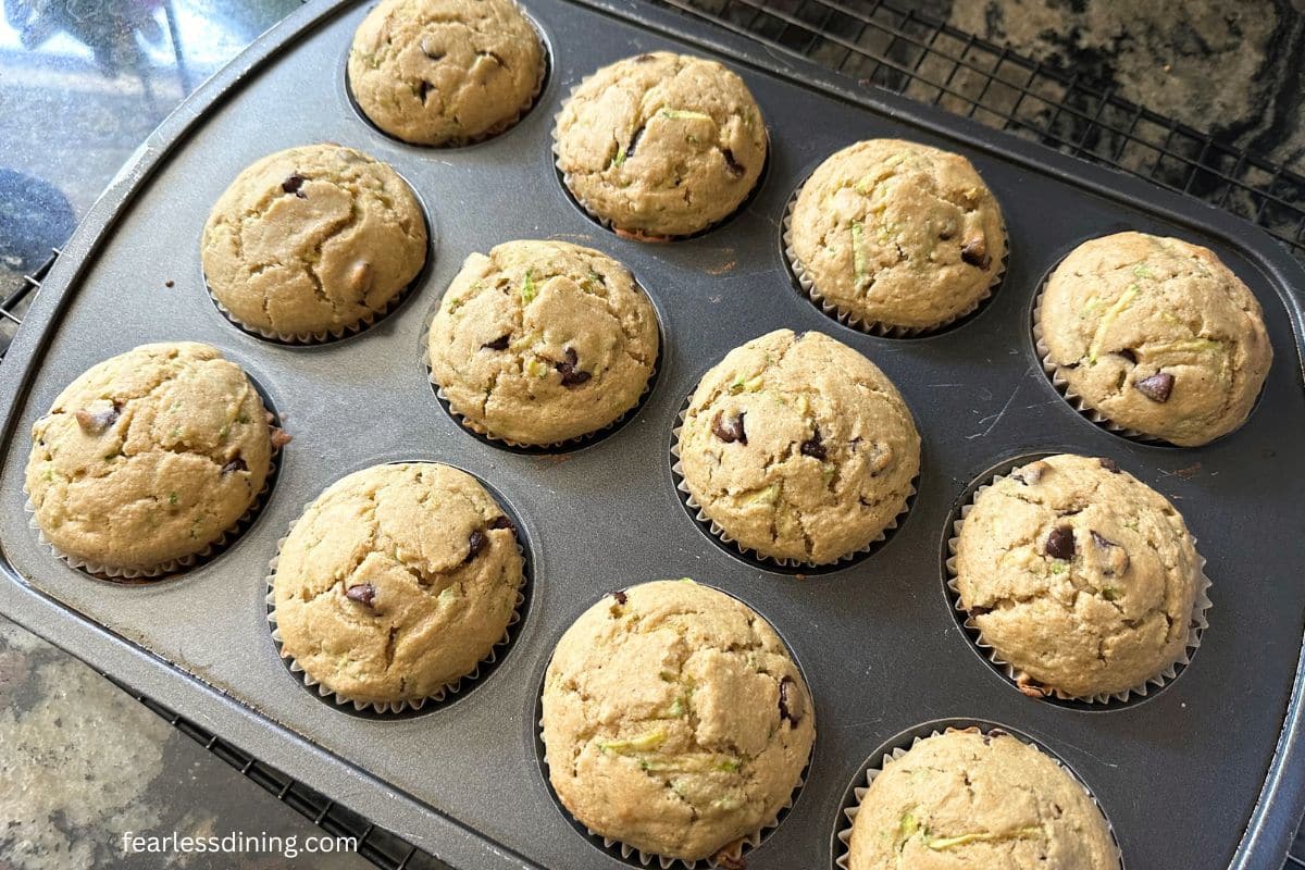 Baked muffins in the pan on the kitchen counter.