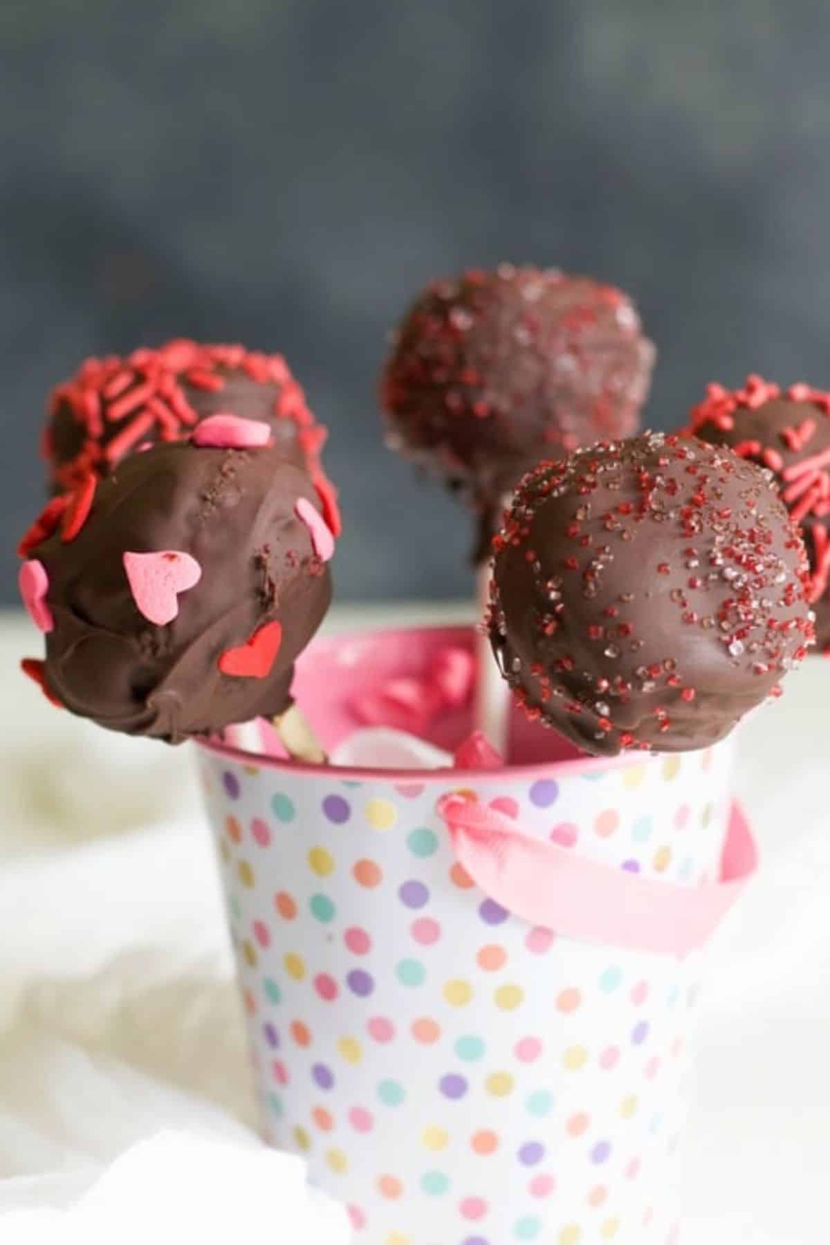A little pail filled with gluten-free Valentine's day cake pops.