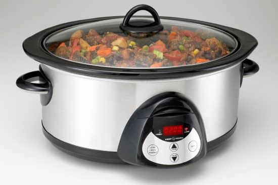 A crock pot filled with stew.
