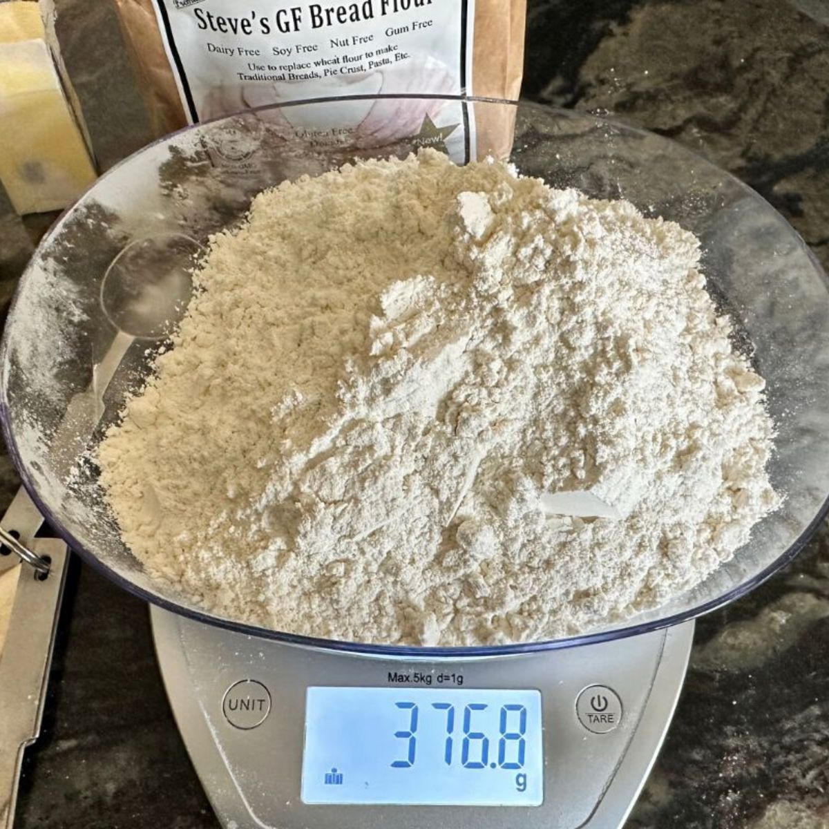 An image of gluten free flour on a digital scale.