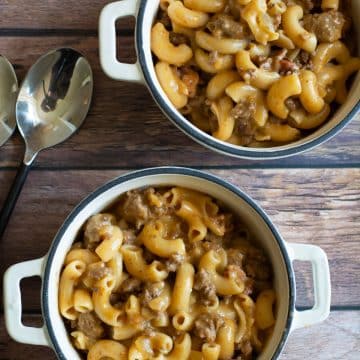 Two bowls of Gluten Free Hamburger Helper on a wooden table.