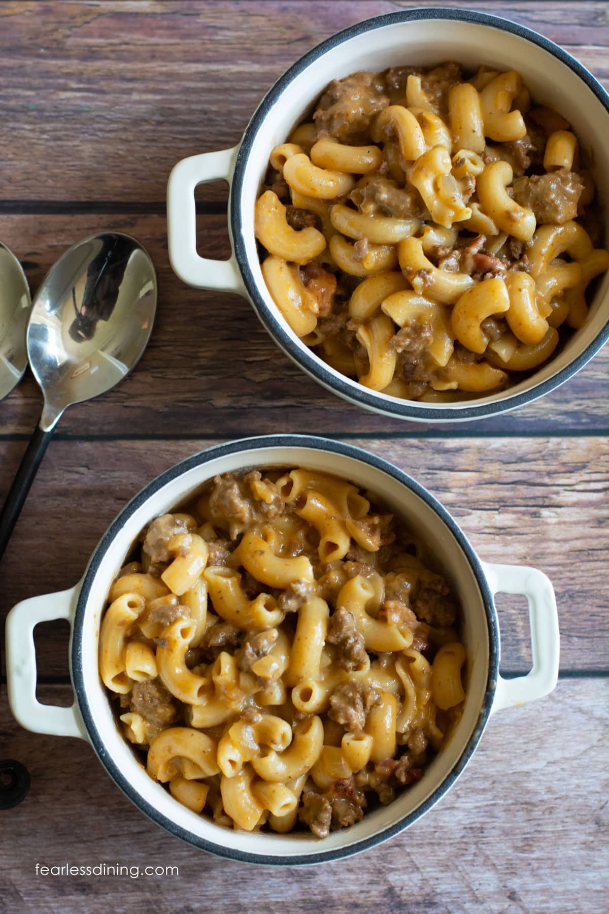 Two bowls of Gluten Free Hamburger Helper on a wooden table.