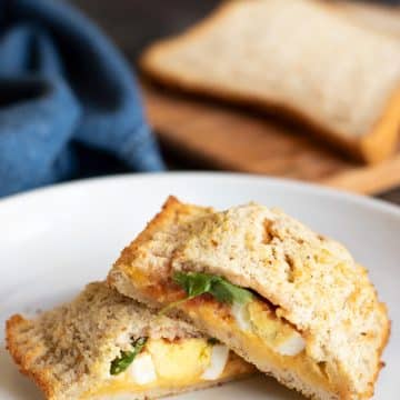 A gluten free hot pocket cut in half so you can see the fillings.