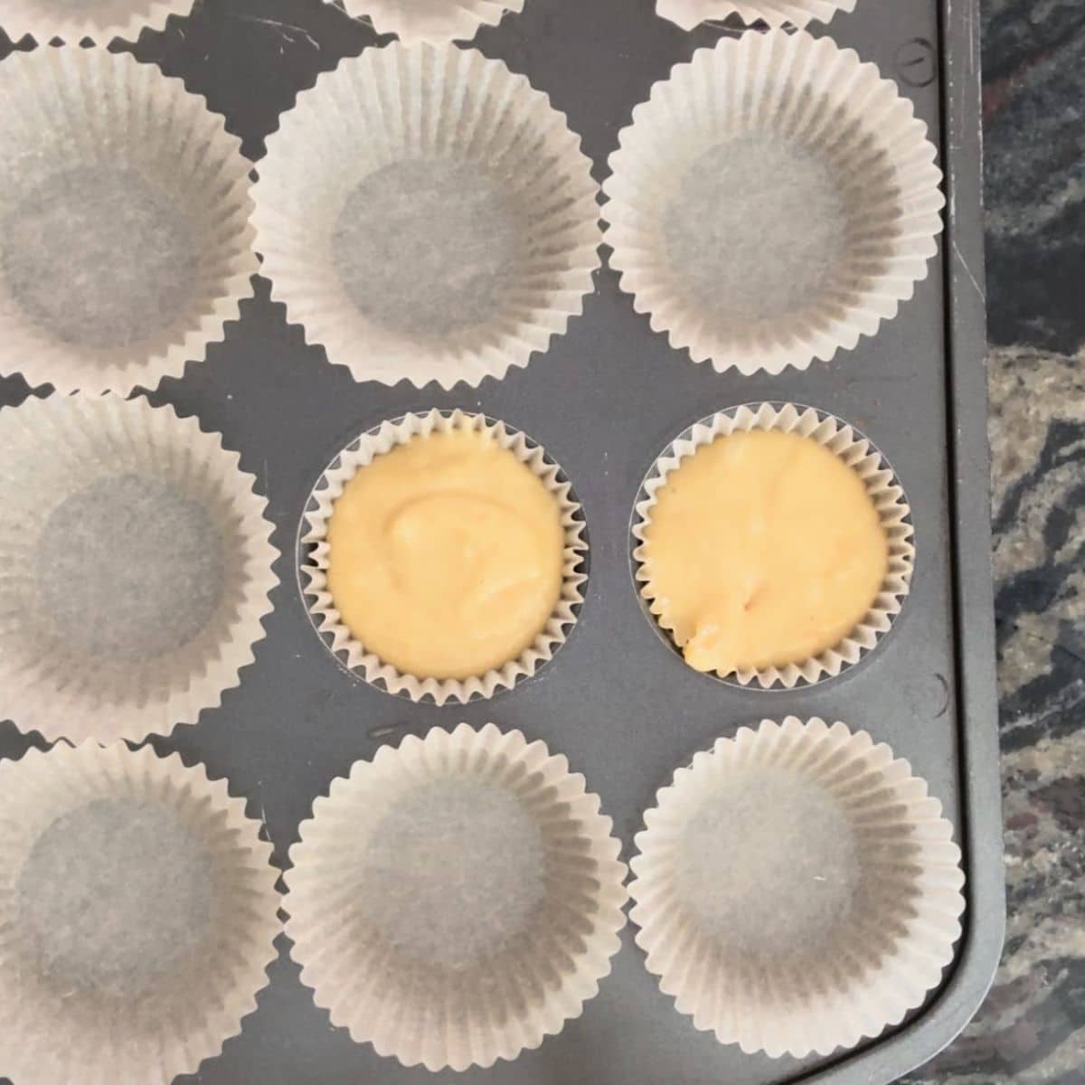 Muffin liners in a pan.