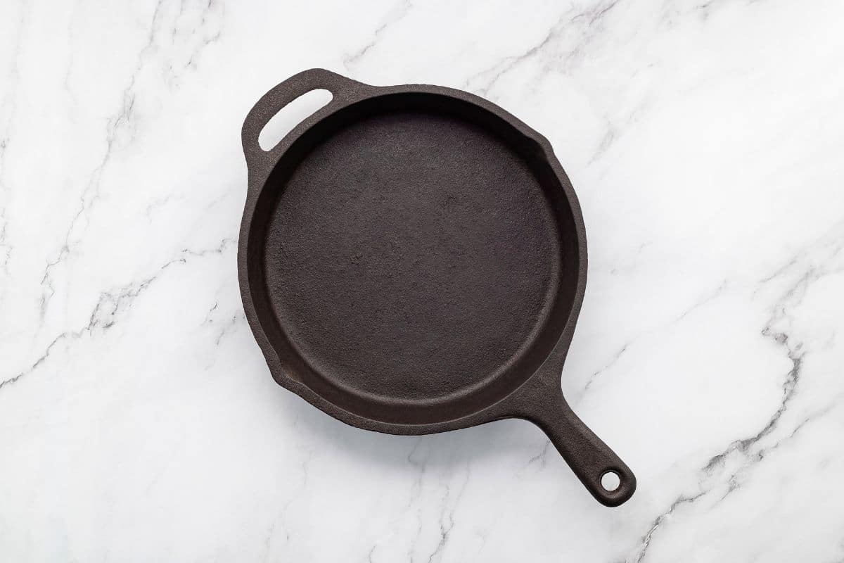 An image of a large cast iron skillet.