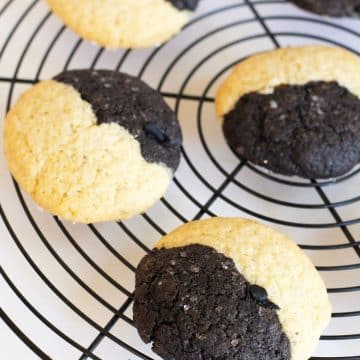 Gluten free vanilla chocolate cookies on a cooling rack.