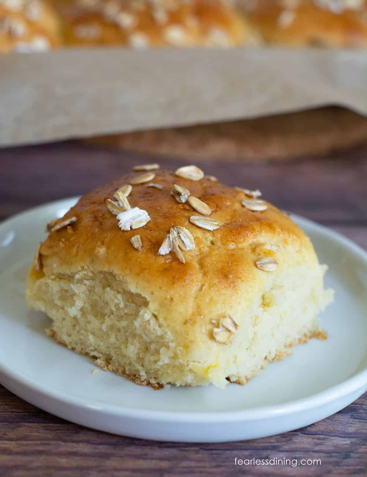 A honey roll on a small white plate.