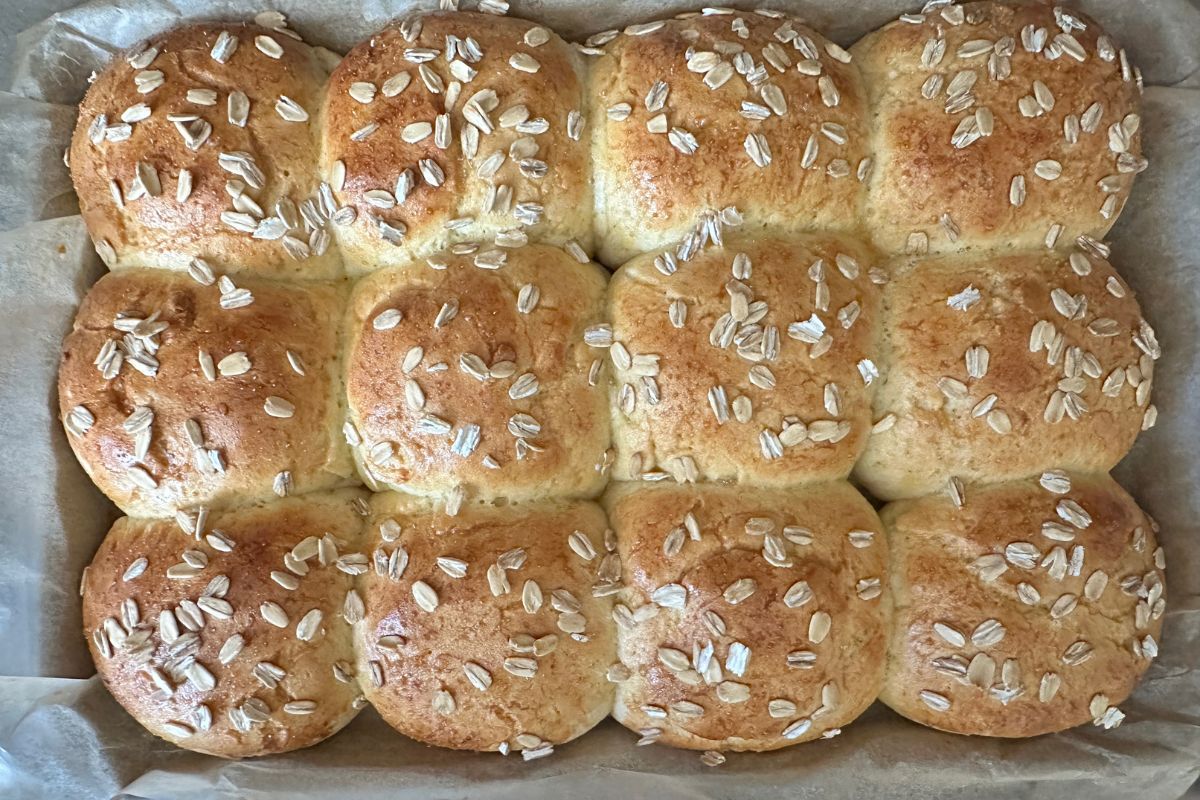 The pan filled with baked honey rolls.