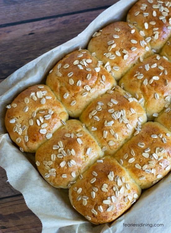 A pan filled with baked honey rolls.