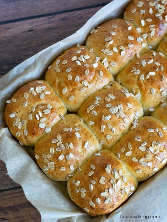 A pan filled with baked honey rolls.