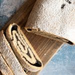 The top view of a sliced poppy seed cake.