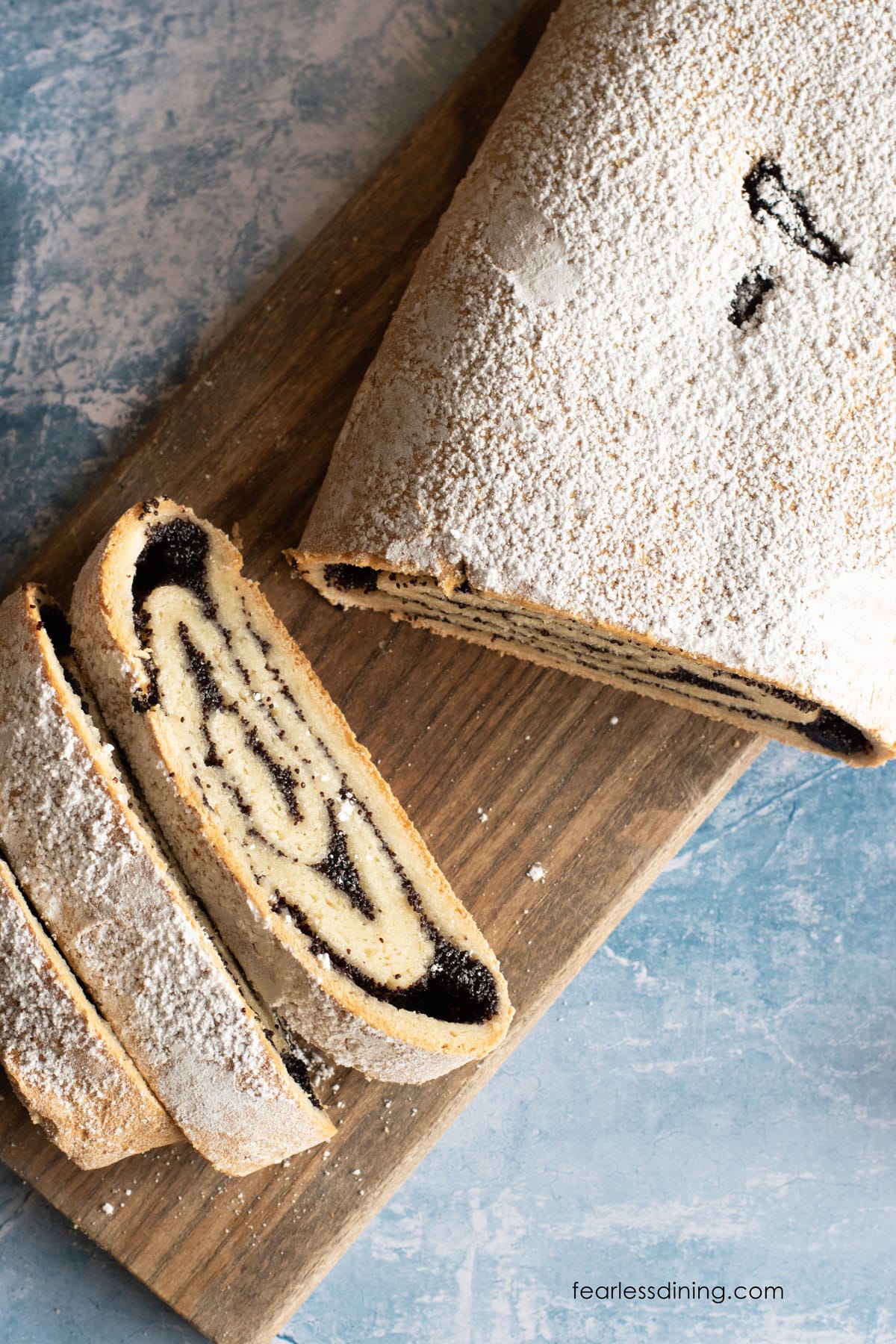 The top view of a sliced poppy seed cake.