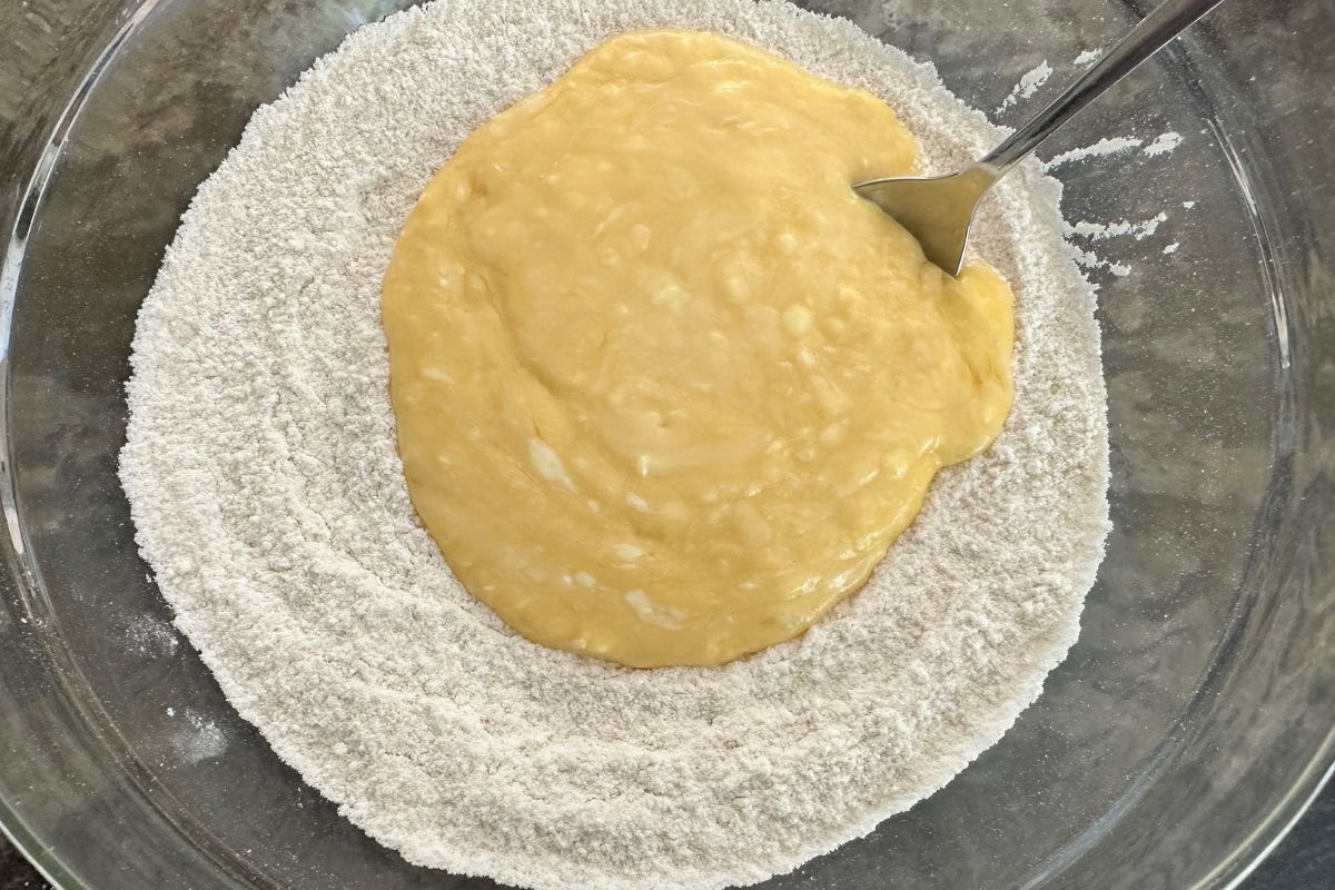 A photo of the wet and dry ingredients in a bowl.
