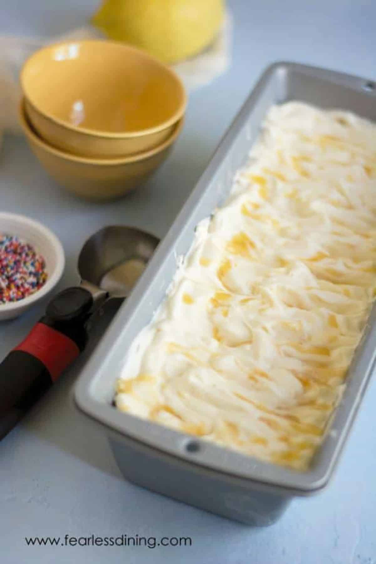 A tin full of lemon curd ice cream.