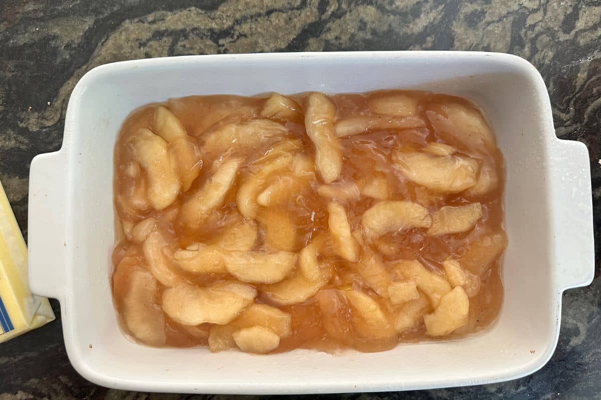 Apple pie filling in a 9x13 baking dish.