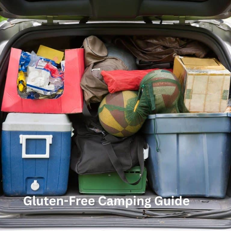 A photo of a mini van loaded with camping supplies.