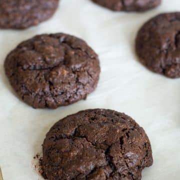 Baked gluten free cake mix cookies on a baking tray.