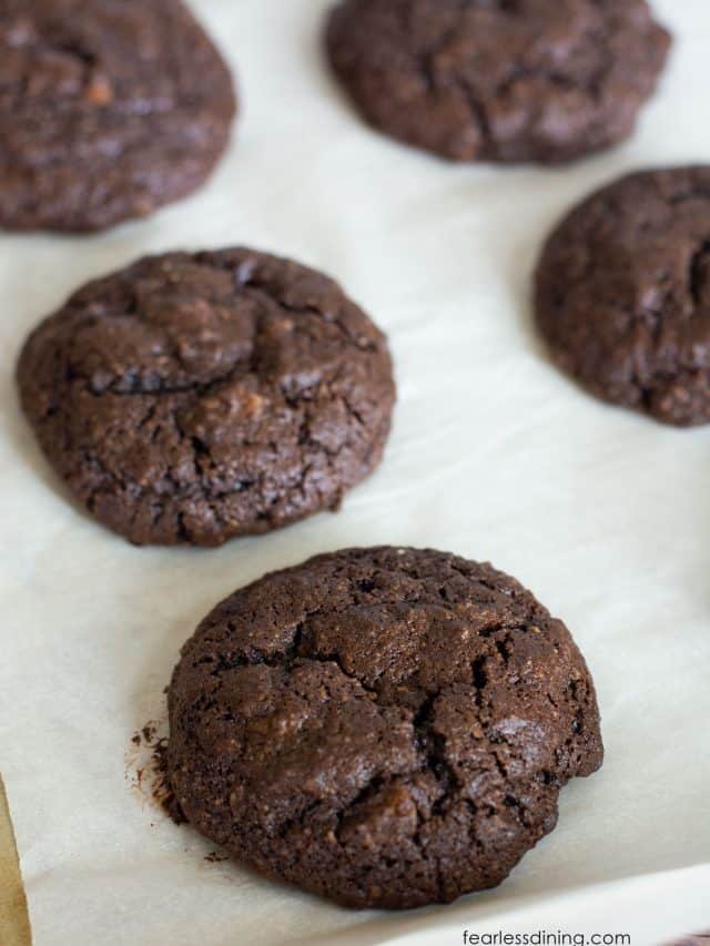 Baked gluten free cake mix cookies on a baking tray.